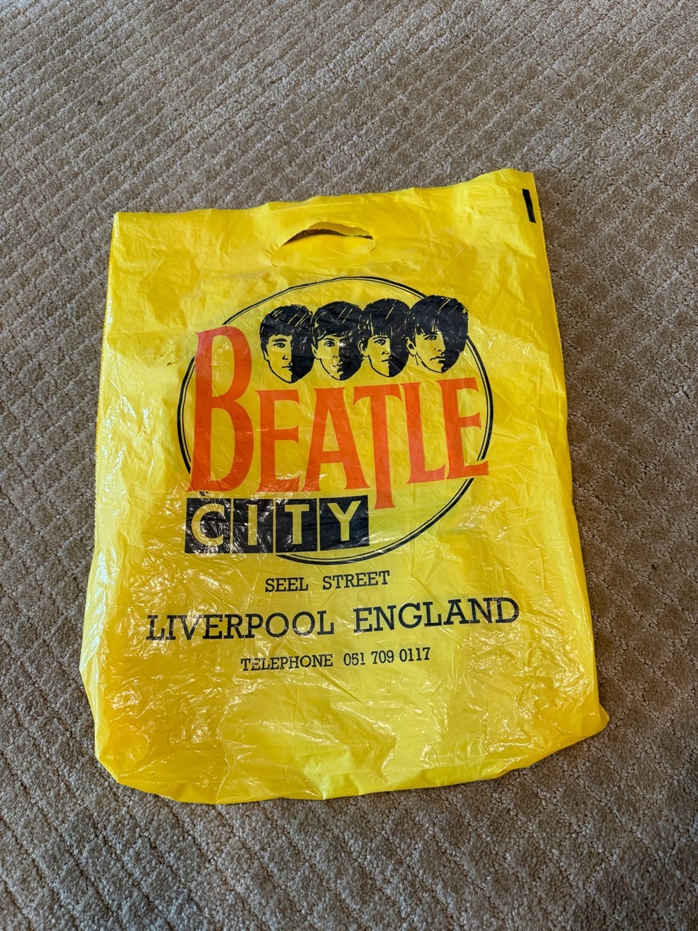 Beatles City Seel Street Liverpool England yellow plastic bag